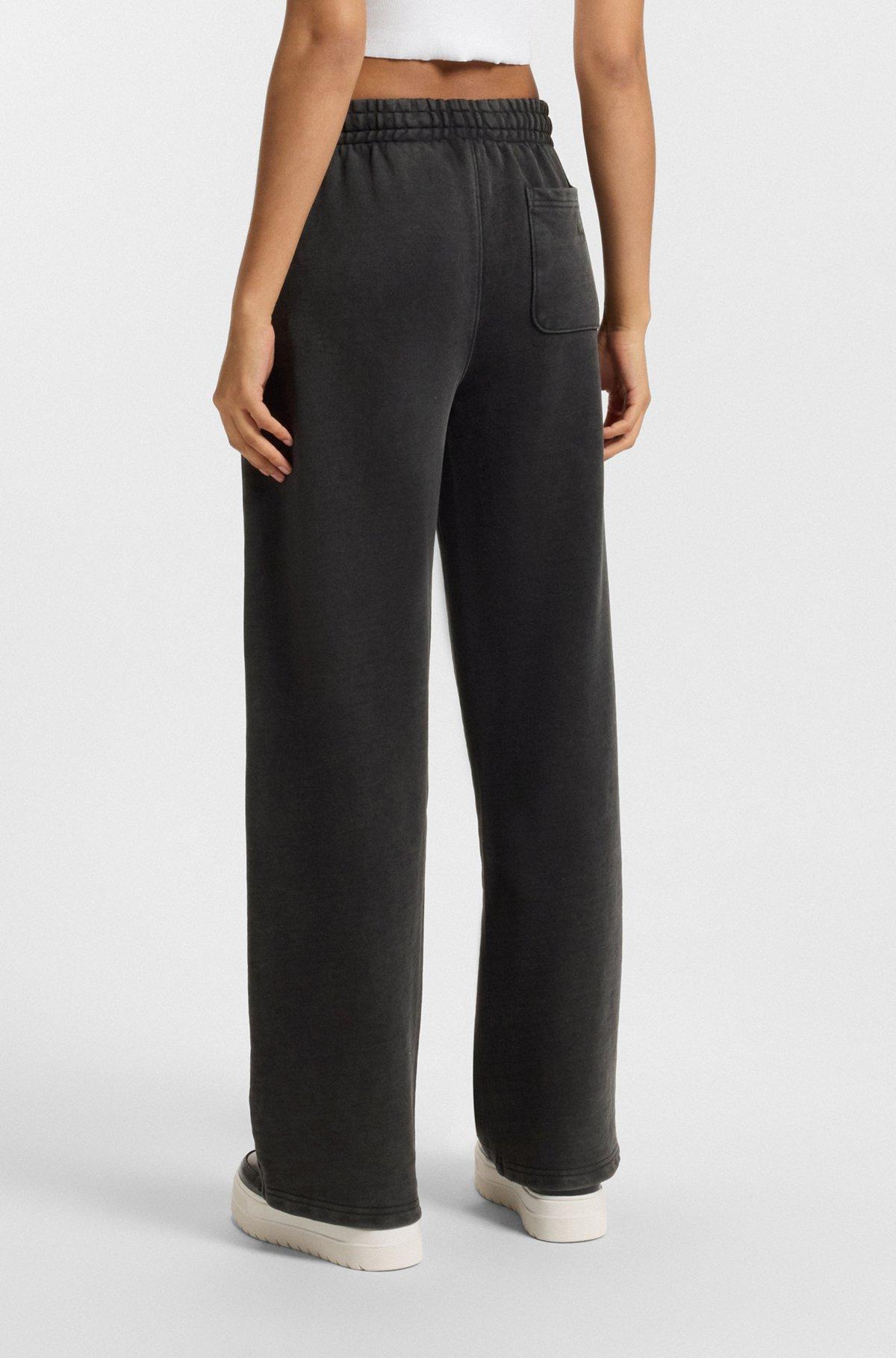 HUGO - Loose-fit tracksuit bottoms in cotton terry - Black Product Image