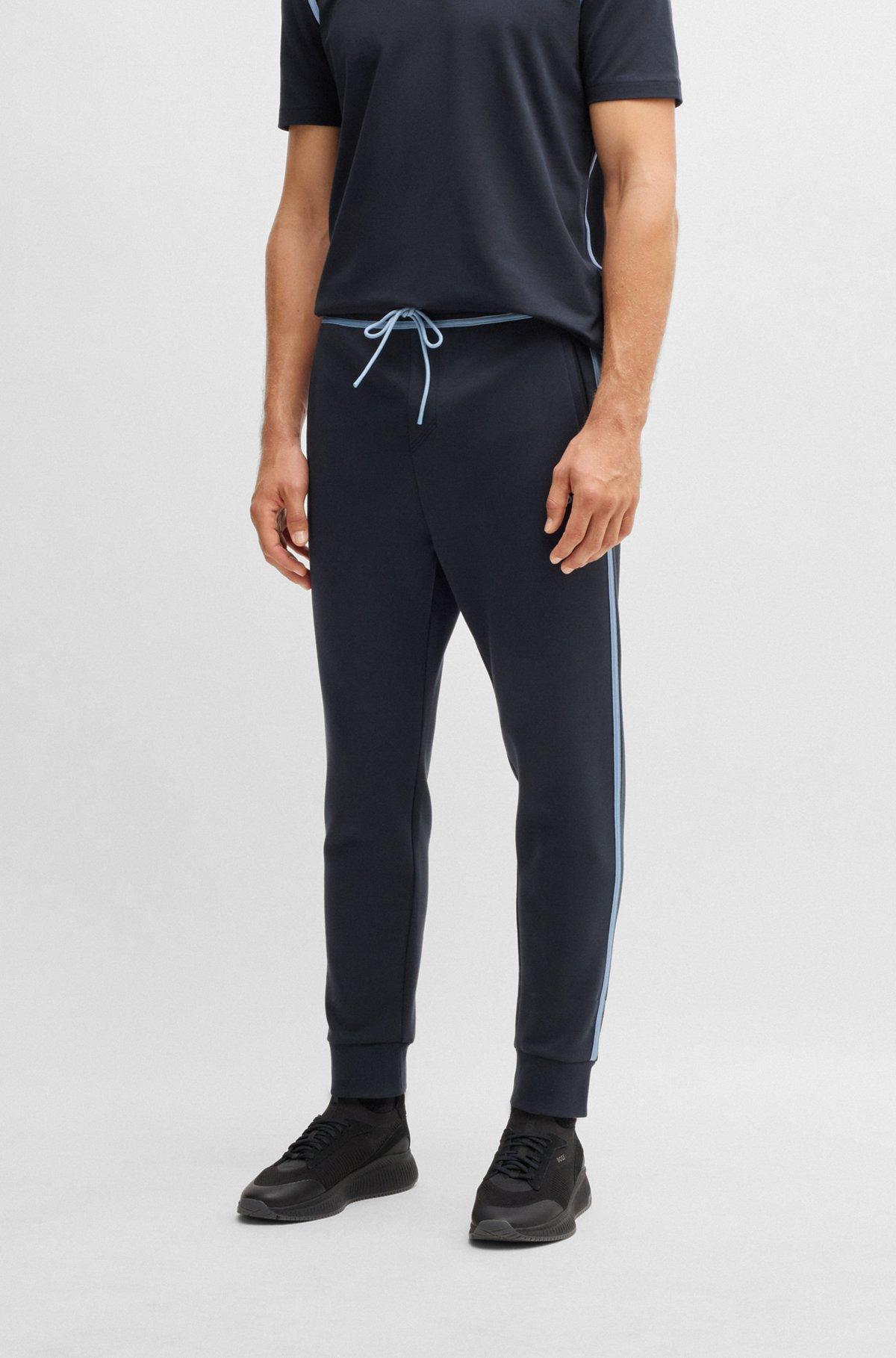 Tracksuit bottoms with tape and logo Product Image