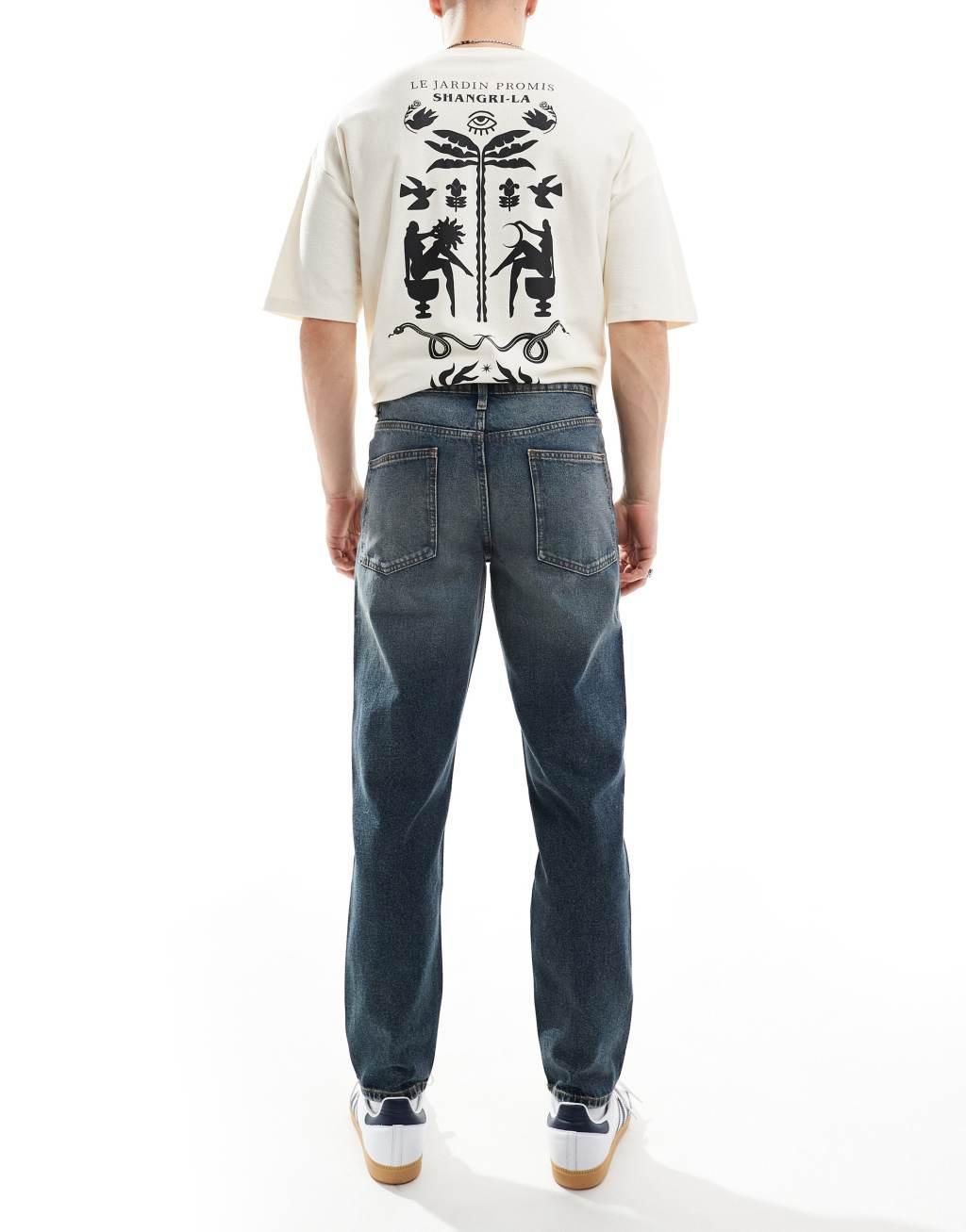 ASOS DESIGN tapered fit jeans in mid wash blue with tint  Product Image