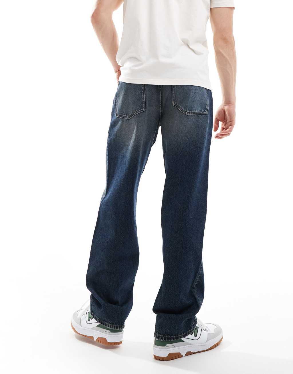 ASOS DESIGN baggy jeans in mid wash blue with heavy wash Product Image