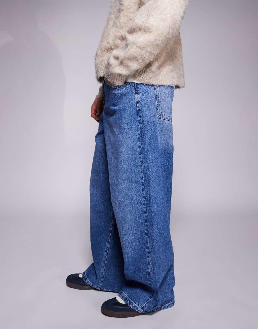 ASOS DESIGN super baggy jeans with back print in mid wash blue Product Image