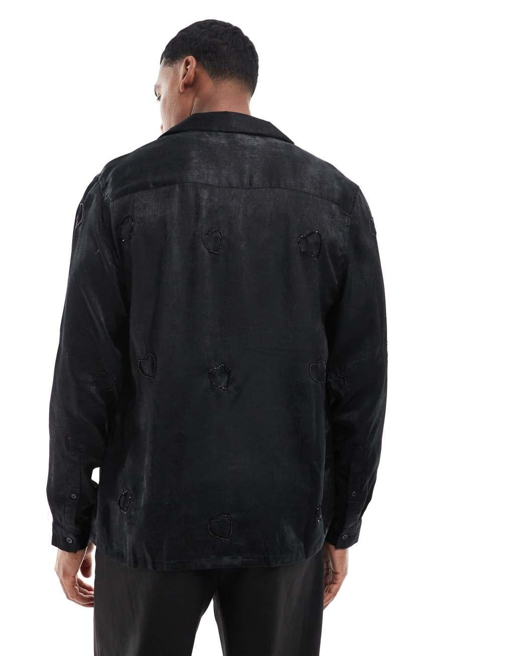 ASOS DESIGN deep camp collar satin shirt with heart embellishment in black Product Image