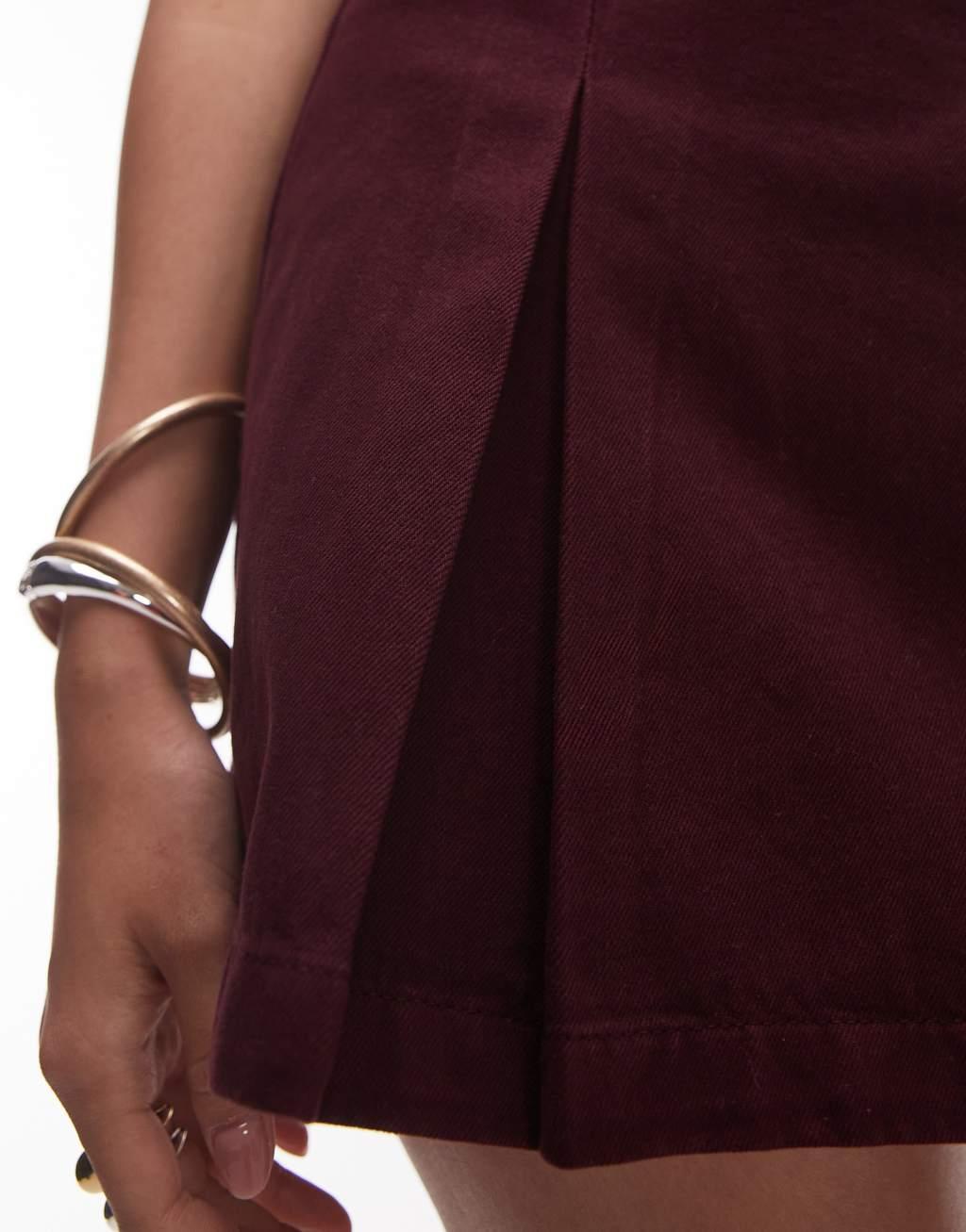 Topshop denim box pleat mini skirt in burgundy Product Image