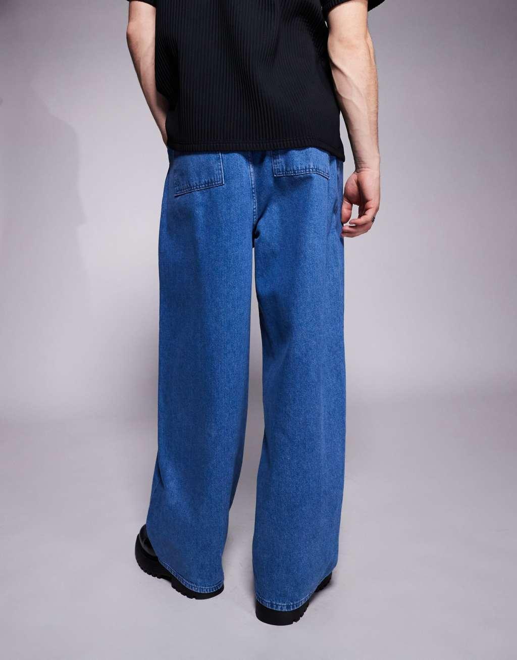 ASOS DESIGN oversized baggy jeans with side belts in mid wash blue Product Image