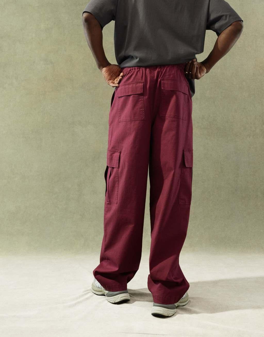 ASOS DESIGN super baggy cargo pants with elastic waist in burgundy Product Image