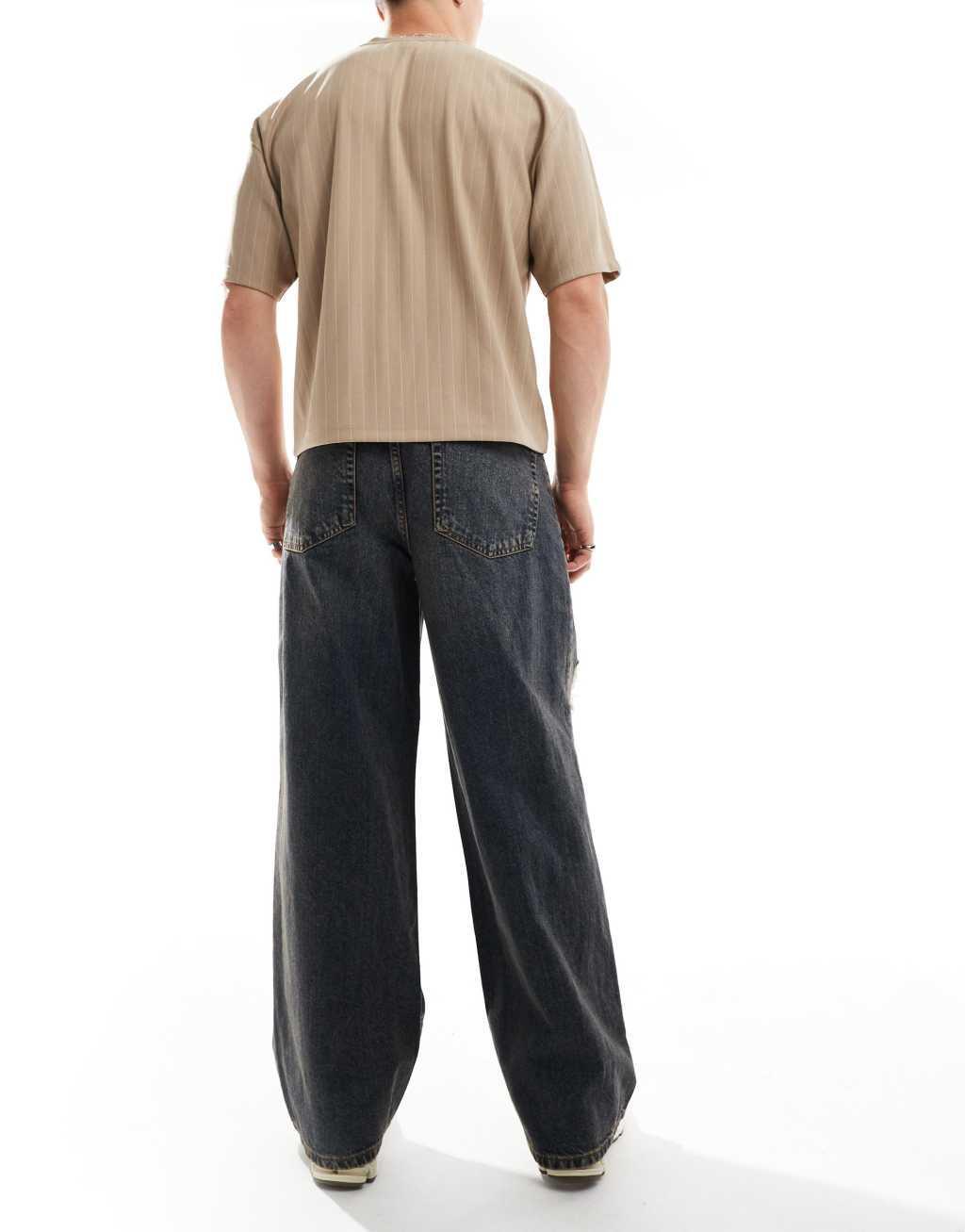 ASOS DESIGN super baggy jeans in tinted mid wash with heavy rips Product Image