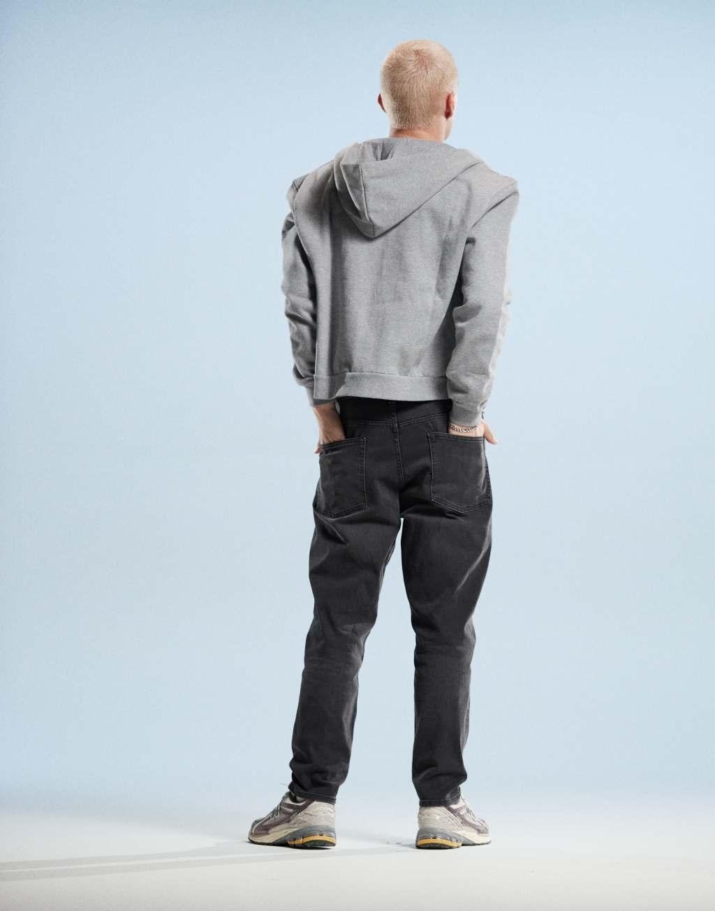 ASOS DESIGN tapered jeans in black wash Product Image