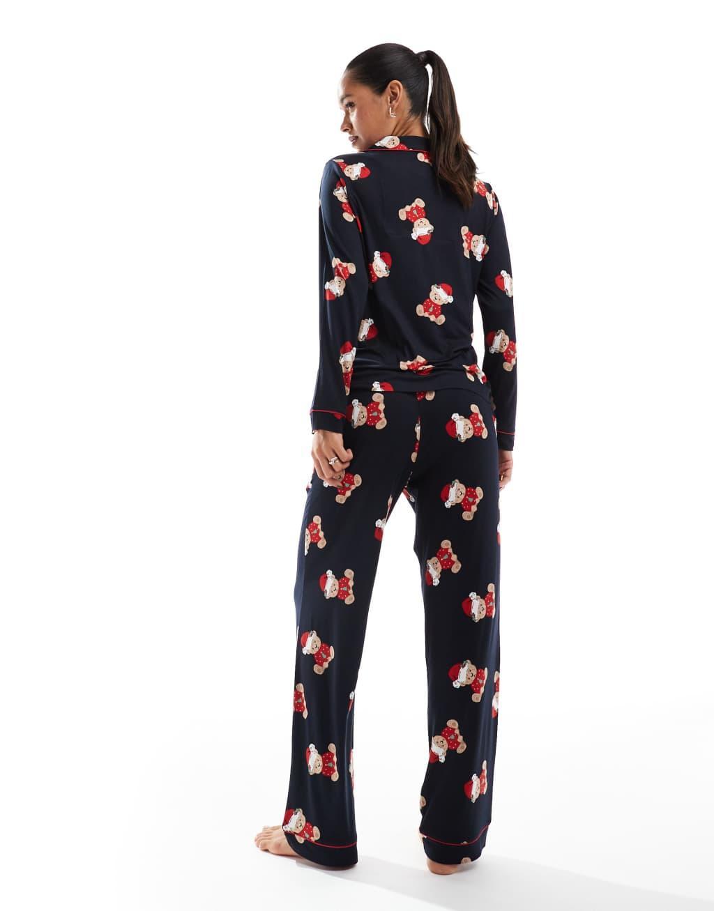 Chelsea Peers Exclusive His & Hers Christmas teddy print long sleeve revere top and pajama pants set in navy Product Image