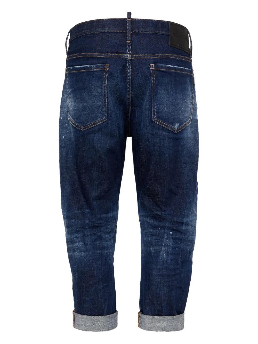 distressed tapered jeans Product Image