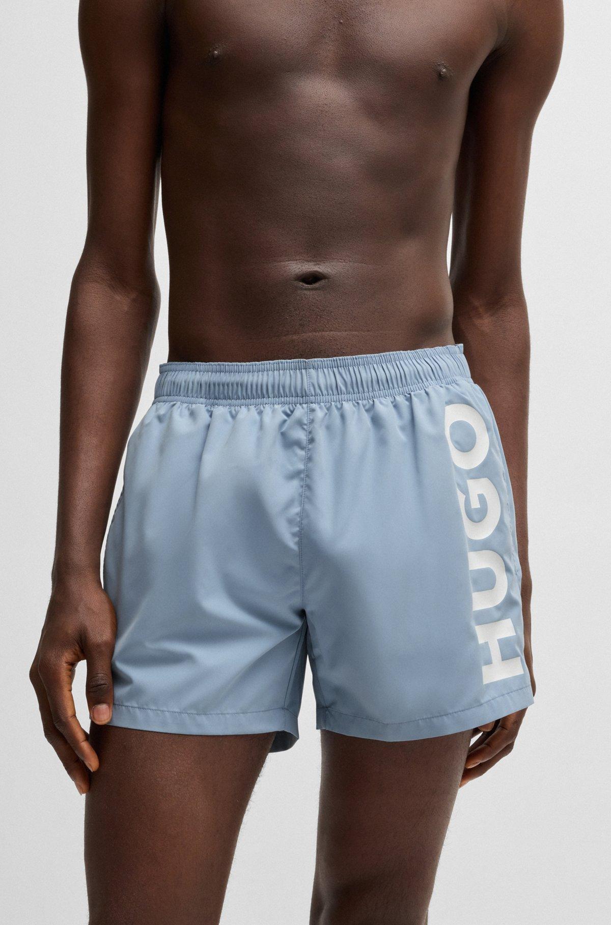 Quick-dry swim shorts with vertical logo print Product Image