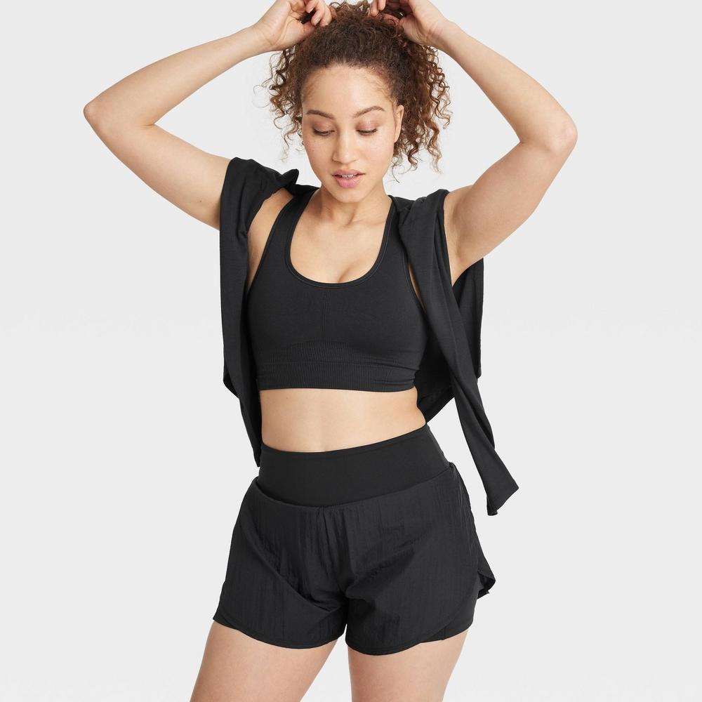 Women's Seamless Medium Support Racerback Midline Sports Bra - All In Motion™ Black M: Moisture Wicking, Removable Padding Product Image