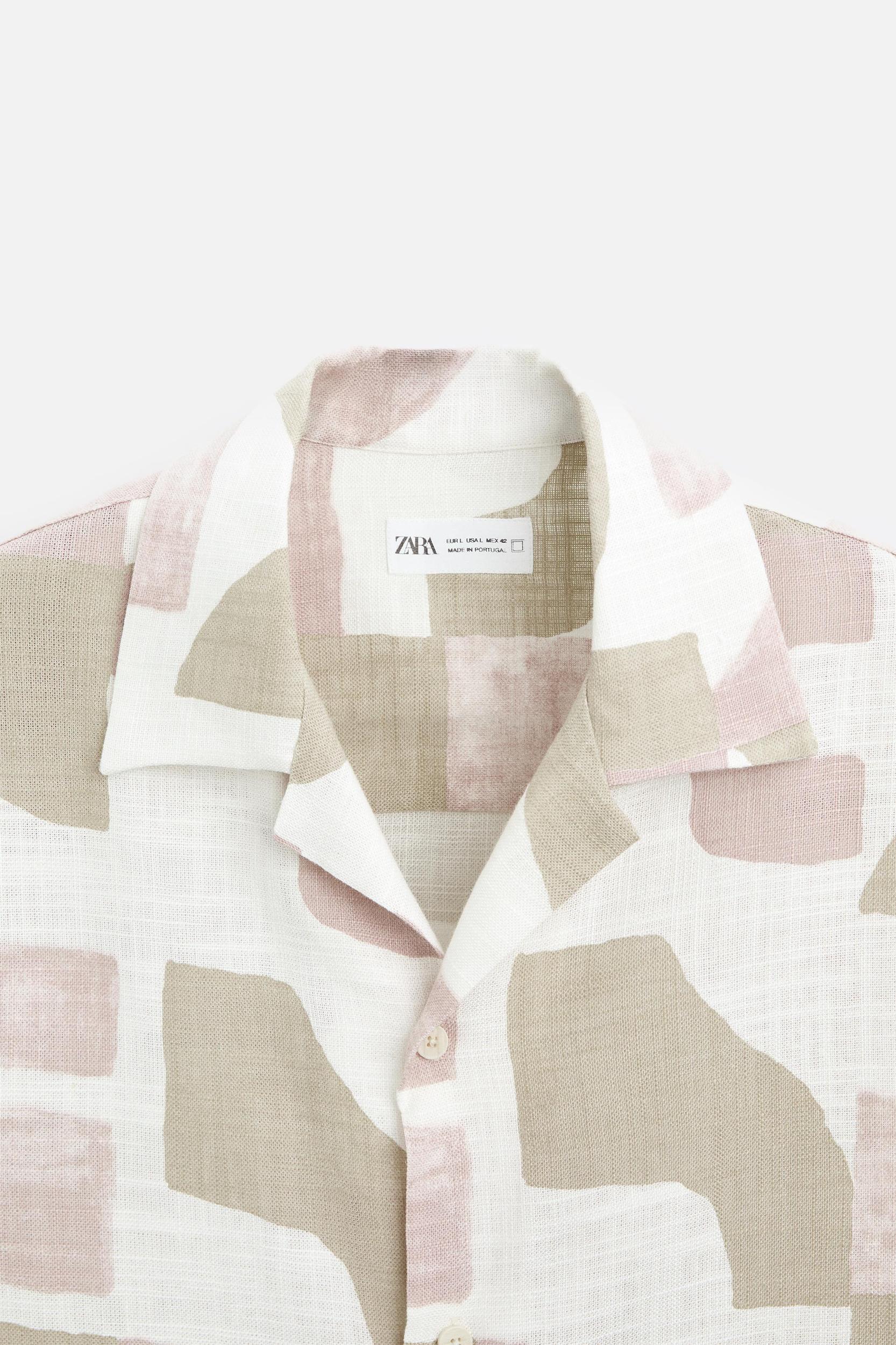 Relaxed fit shirt made of viscose blend fabric. Spread collar and short sleeves. Front button closure. Product Image
