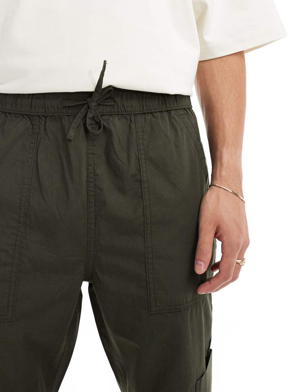 ASOS DESIGN pull on cargo sweatpants in khaki with elastic waist Product Image