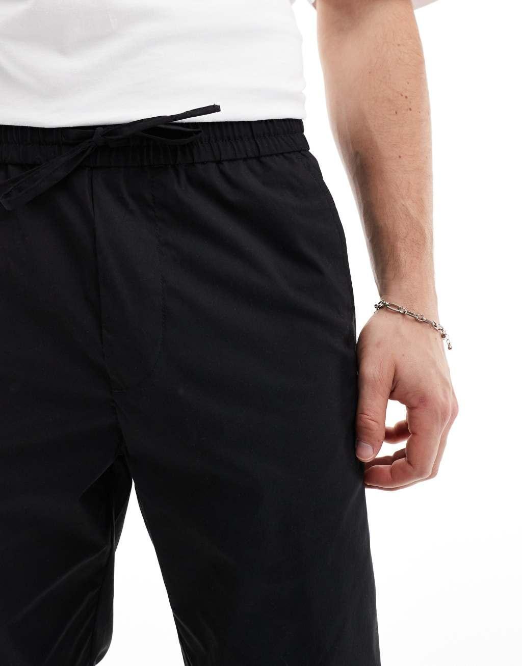 ONLY & SONS pull on tapered fit pants in black Product Image