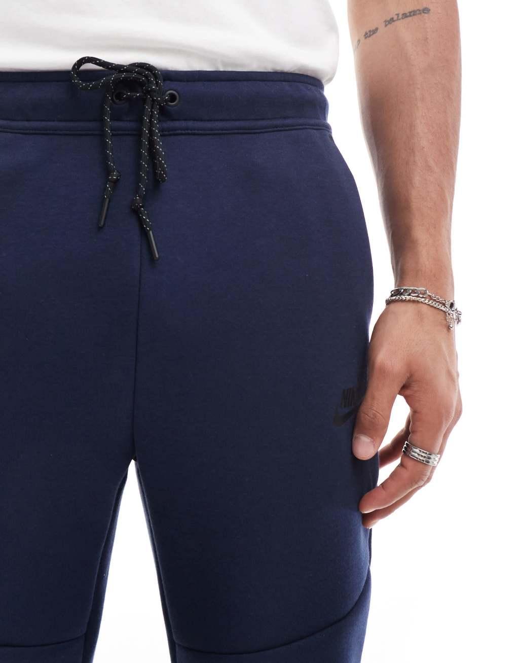 Nike Tech Fleece cuffed sweatpants in navy Product Image
