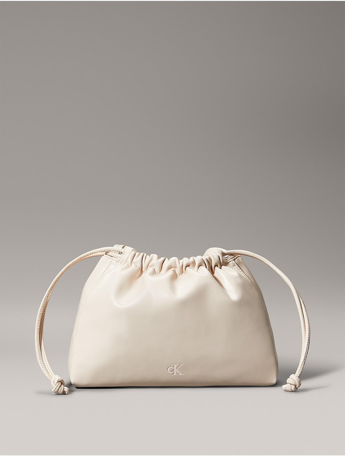 Calvin Klein Women's Monogram Logo Drawstring Crossbody Bag - White Product Image