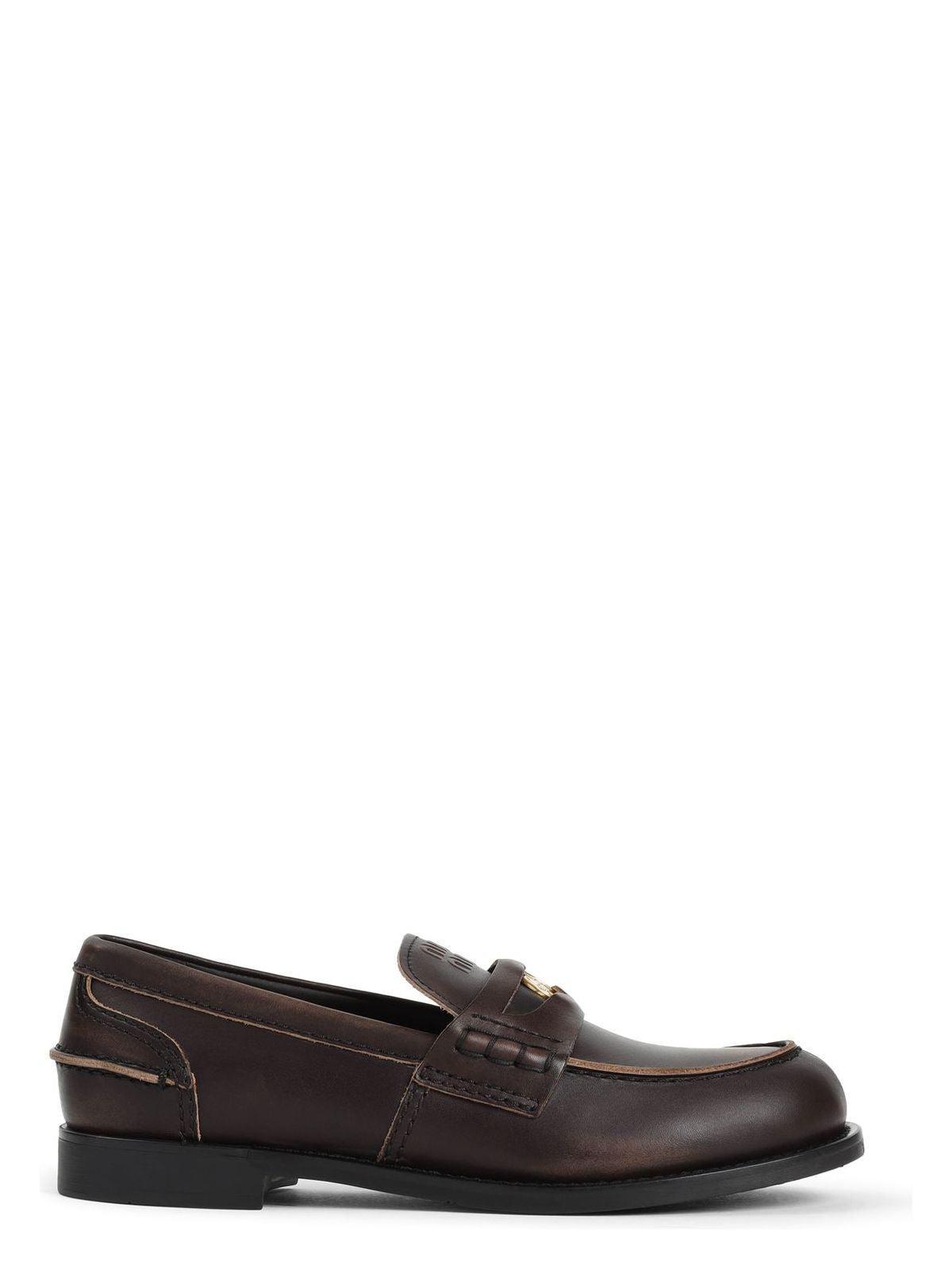 MIU MIU Leather Distressed Penny Loafers In Brown Product Image