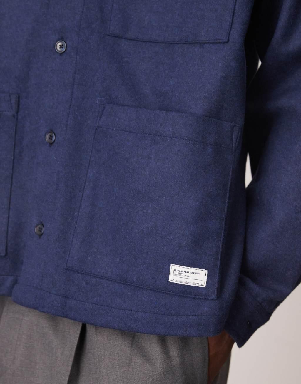 ASOS DESIGN oversized boxy zip through shirt with brushed finish and woven tab in navy Product Image