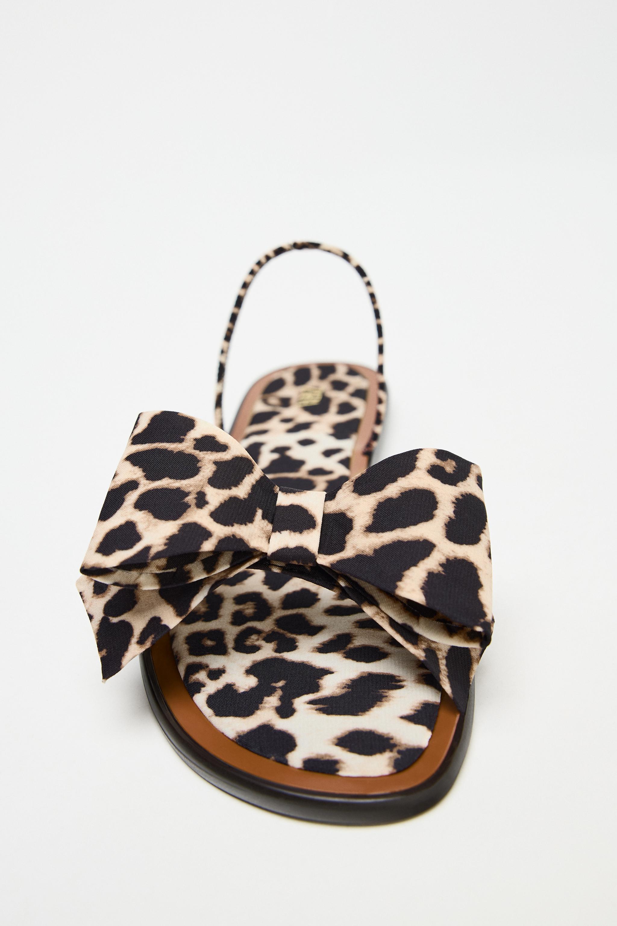 ANIMAL PRINT BOW FLAT SANDALS Product Image