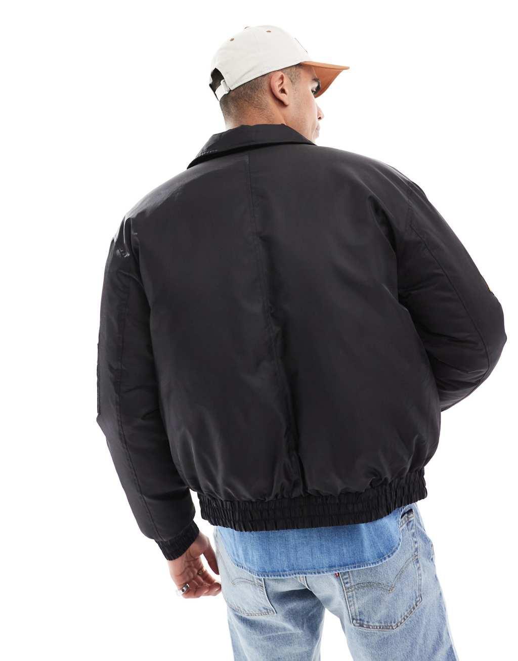 ASOS DESIGN oversized bomber jacket in black with badges Product Image