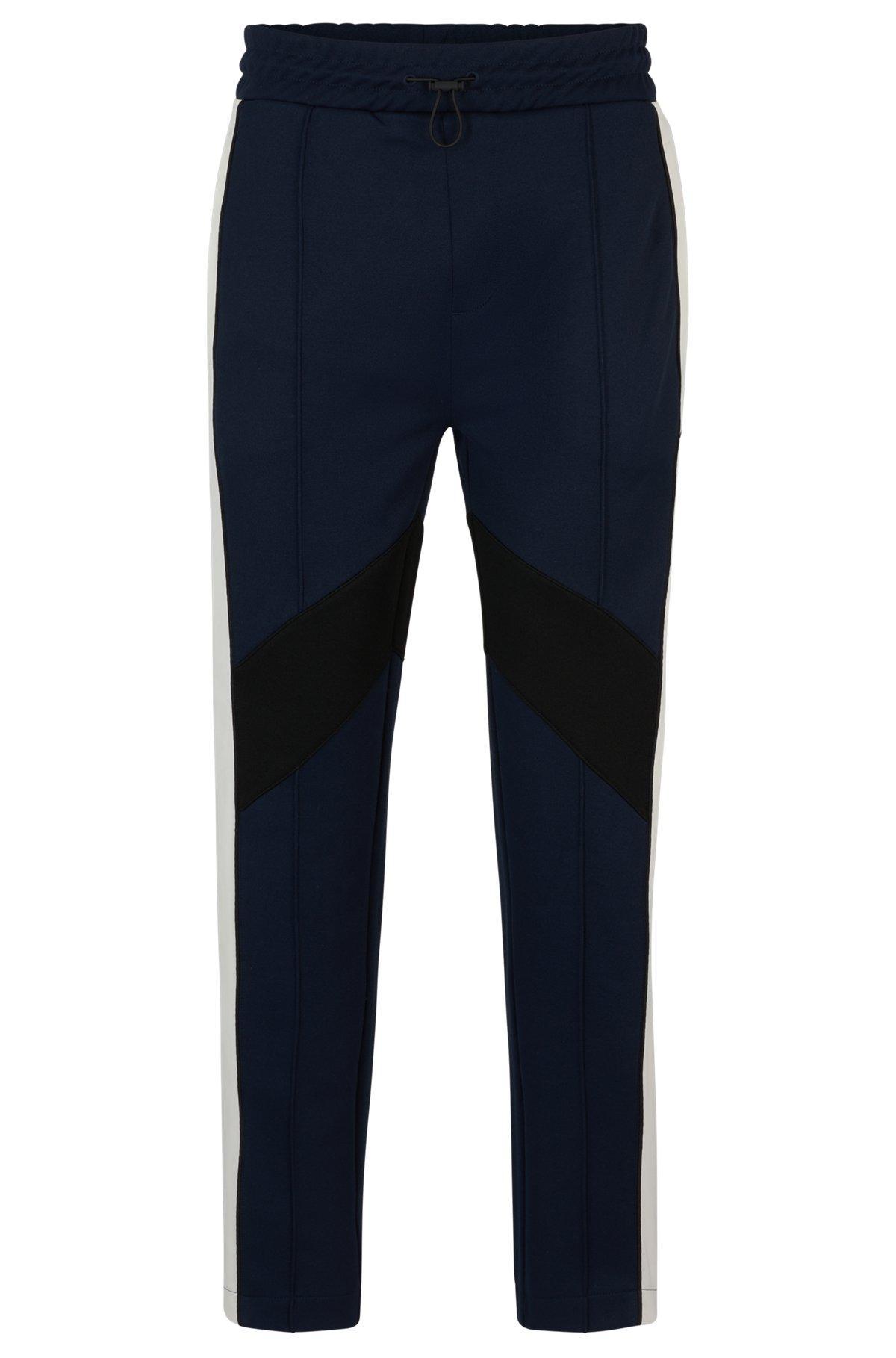 Relaxed-fit tracksuit bottoms with color-blocking Product Image