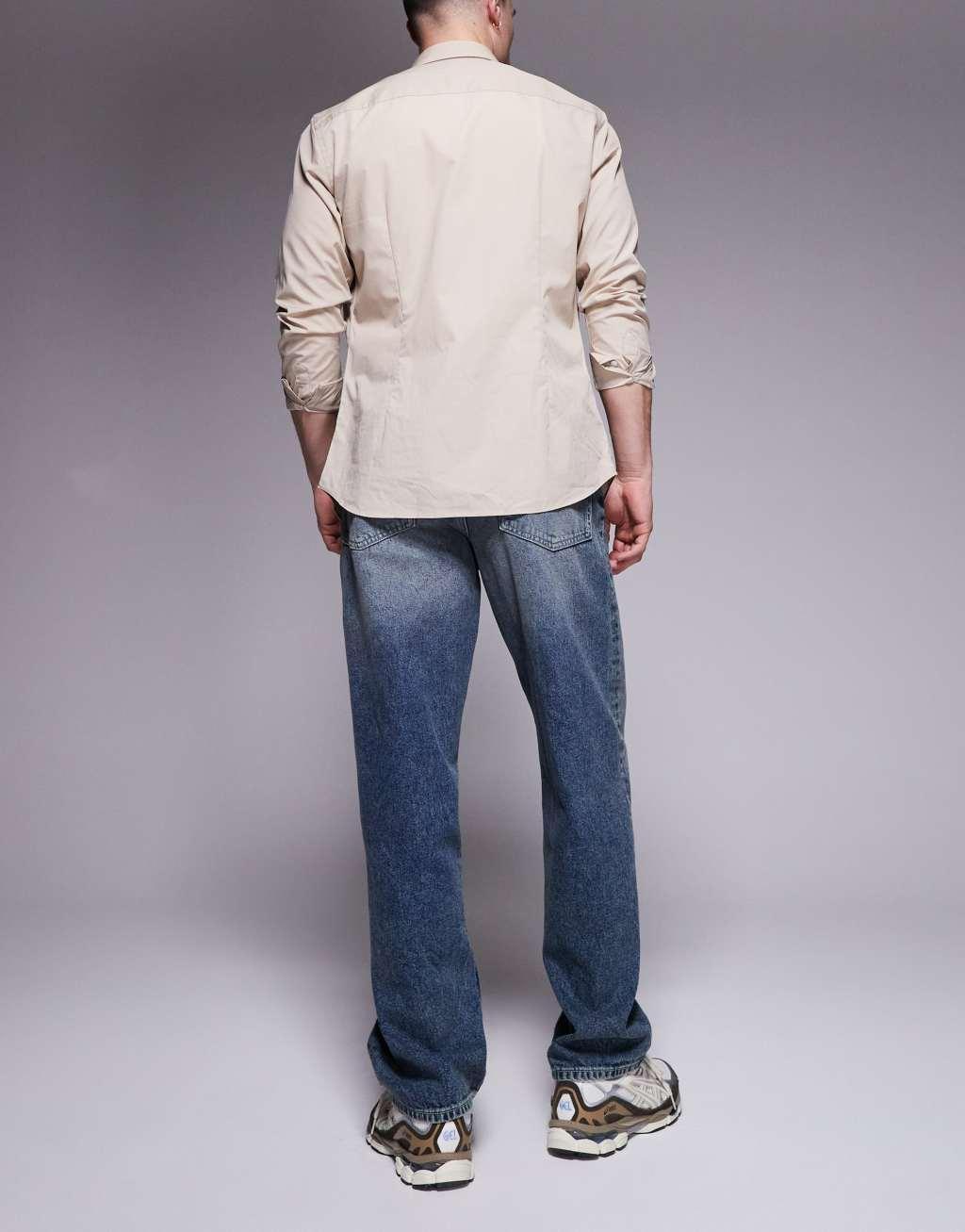 ASOS DESIGN baggy fit jeans in dark wash blue Product Image