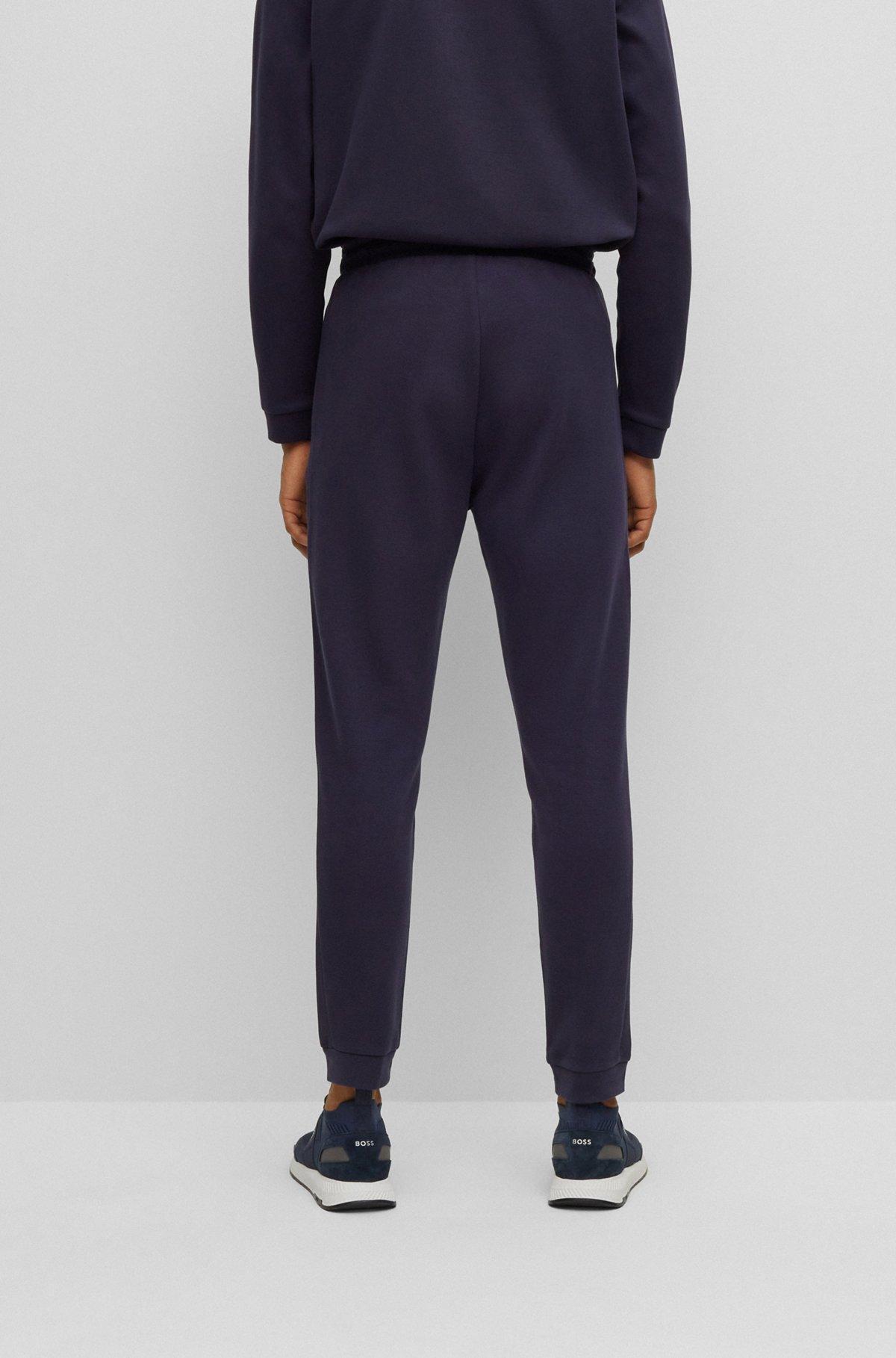 Cotton tracksuit bottoms with curved logo Product Image