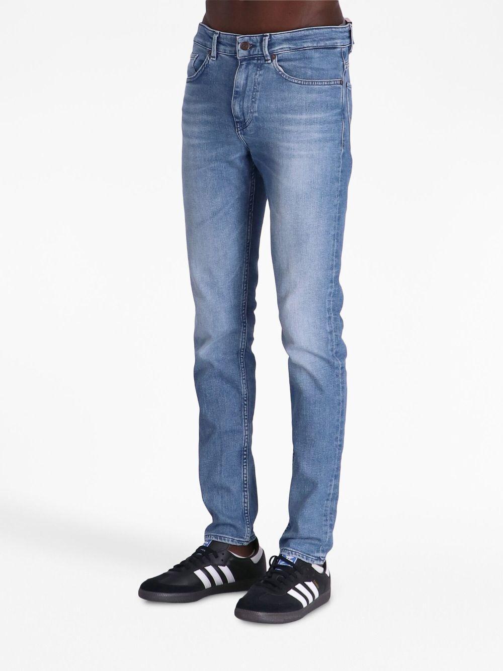 Logo-patch Slim-cut Jeans In Blue Product Image