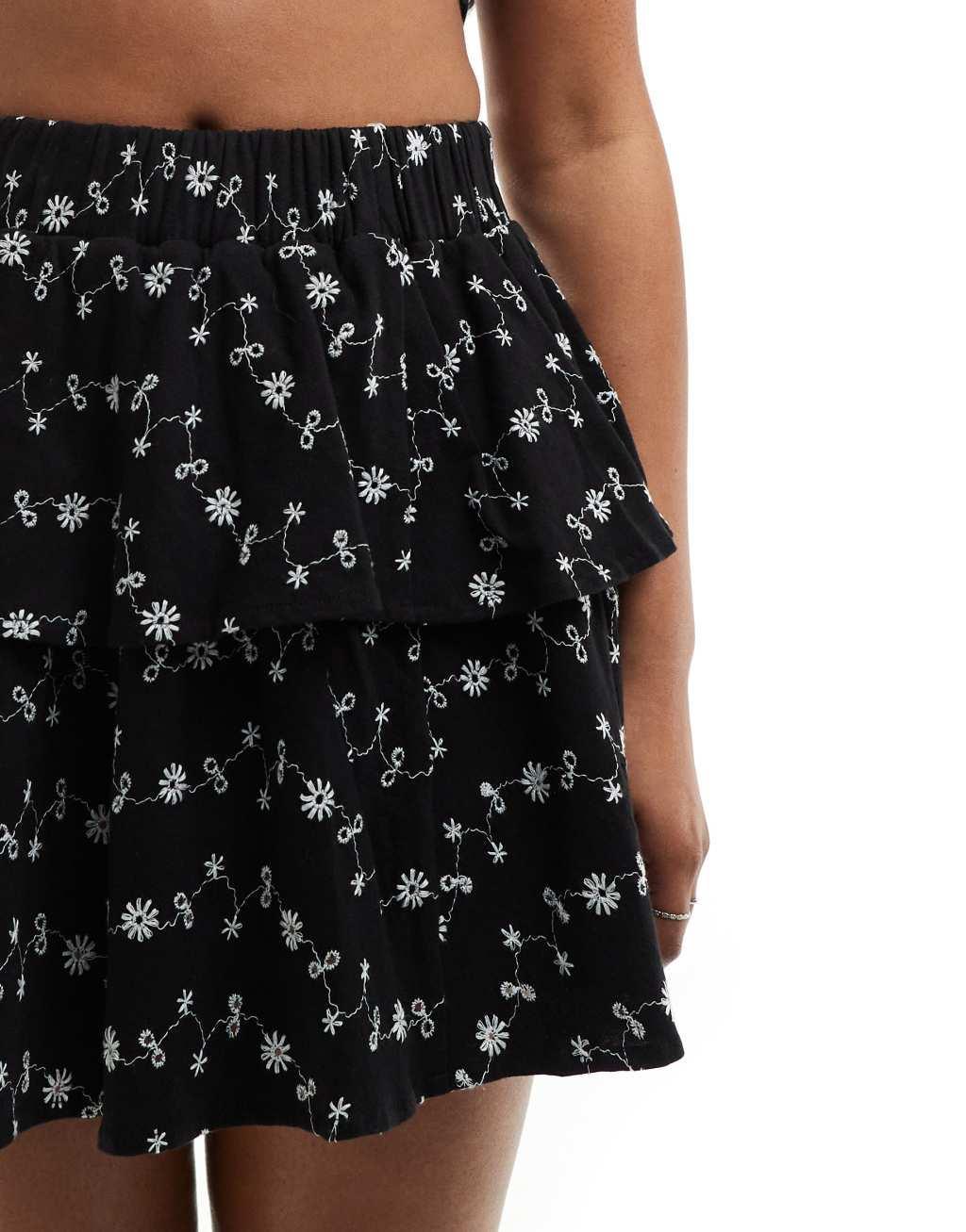 ASOS DESIGN eyelet rara mini skirt in black Product Image