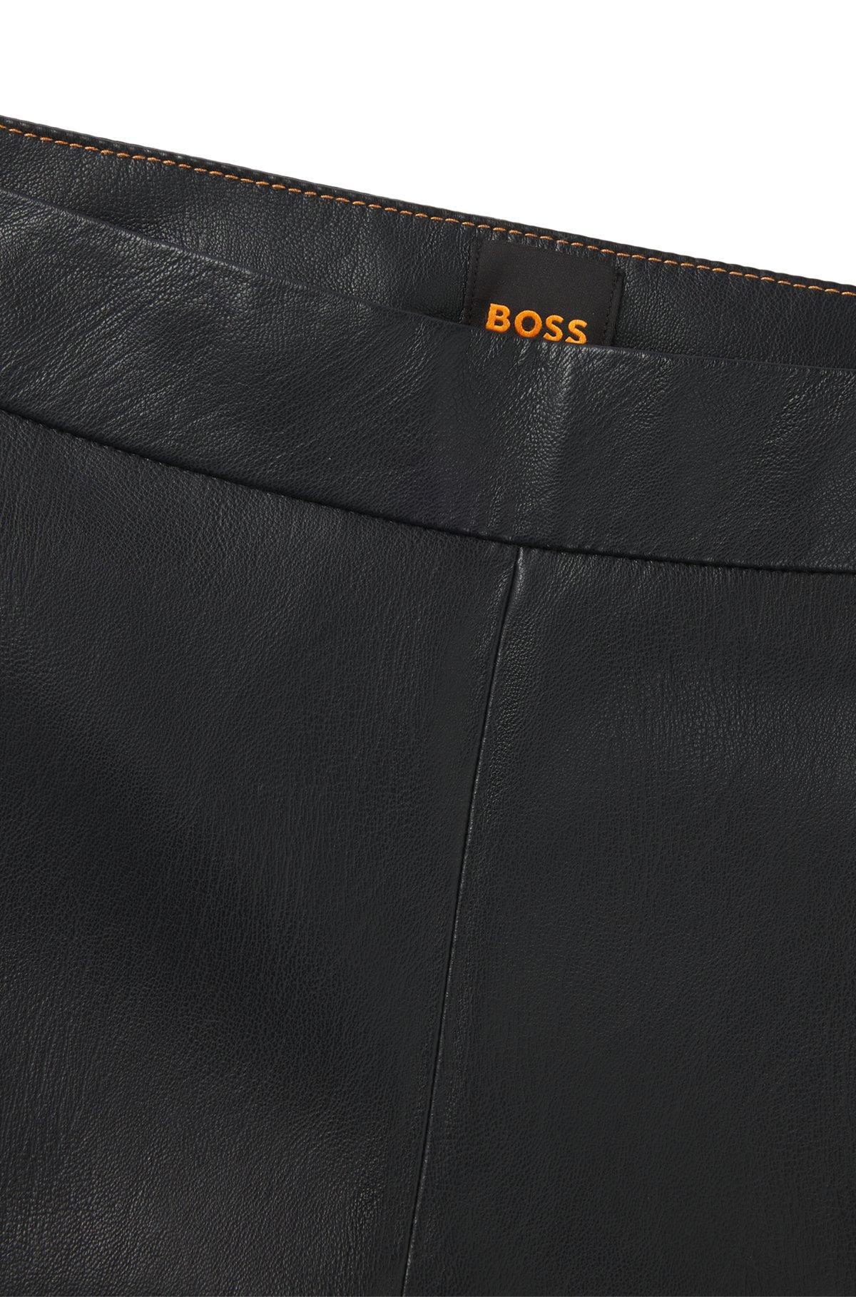 Paneled trousers in coated faux leather Product Image