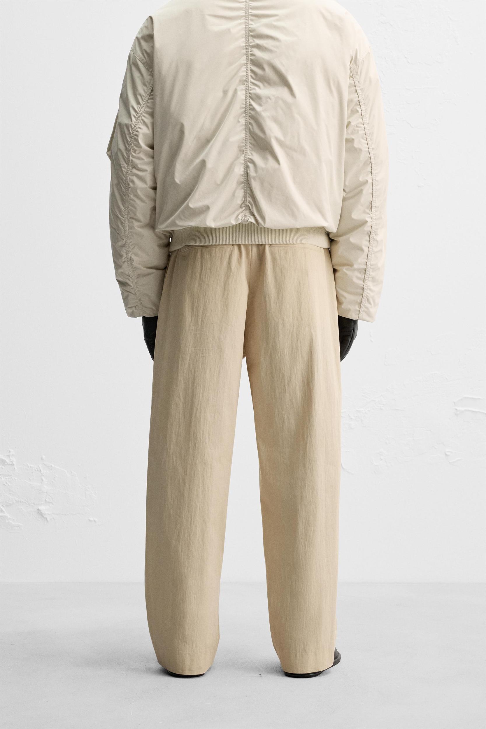 LIMITED EDITION RELAXED FIT PLEATED PANTS Product Image