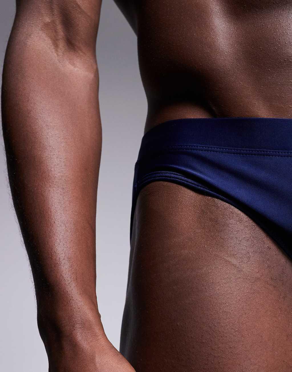 ASOS DESIGN swim briefs in navy Product Image