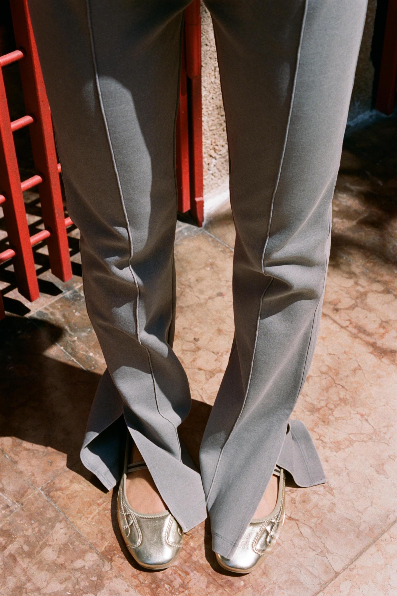 WASHED EFFECT FLARED INTERLOCK PANTS Product Image