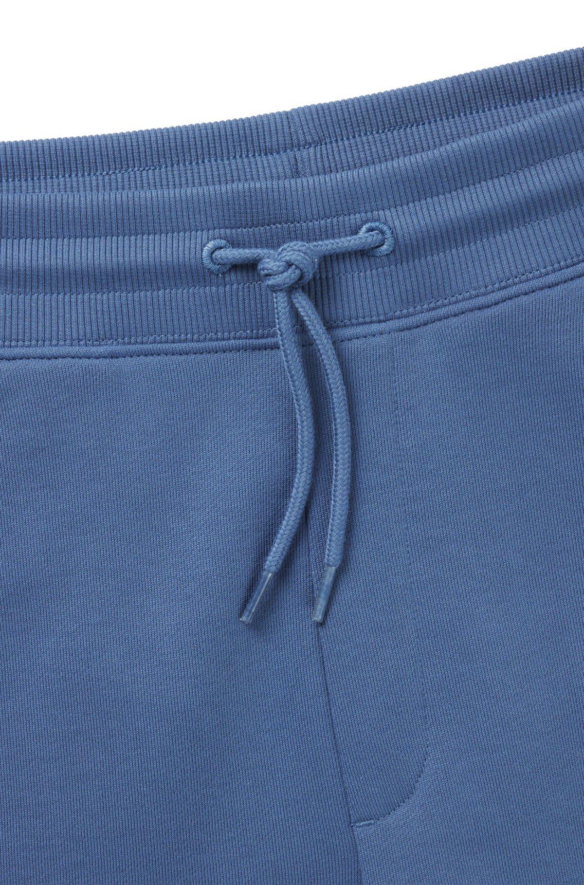 Cotton-terry tracksuit bottoms with logo label Product Image