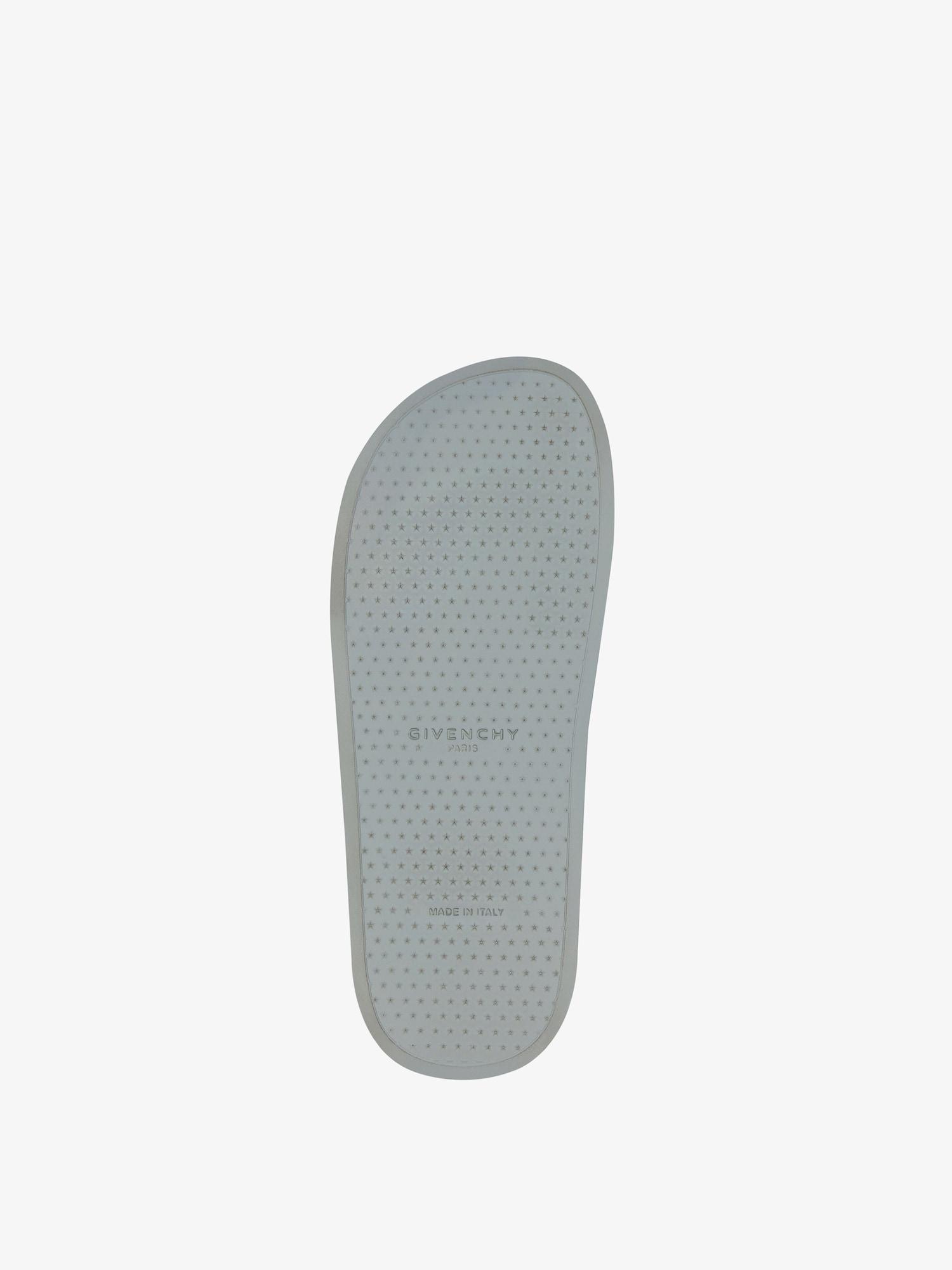 Slide flat sandals in monogram 72 rubber Product Image