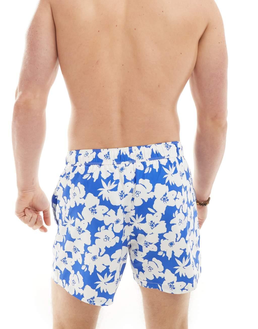 ASOS DESIGN swim shorts in short length in blue floral print Product Image
