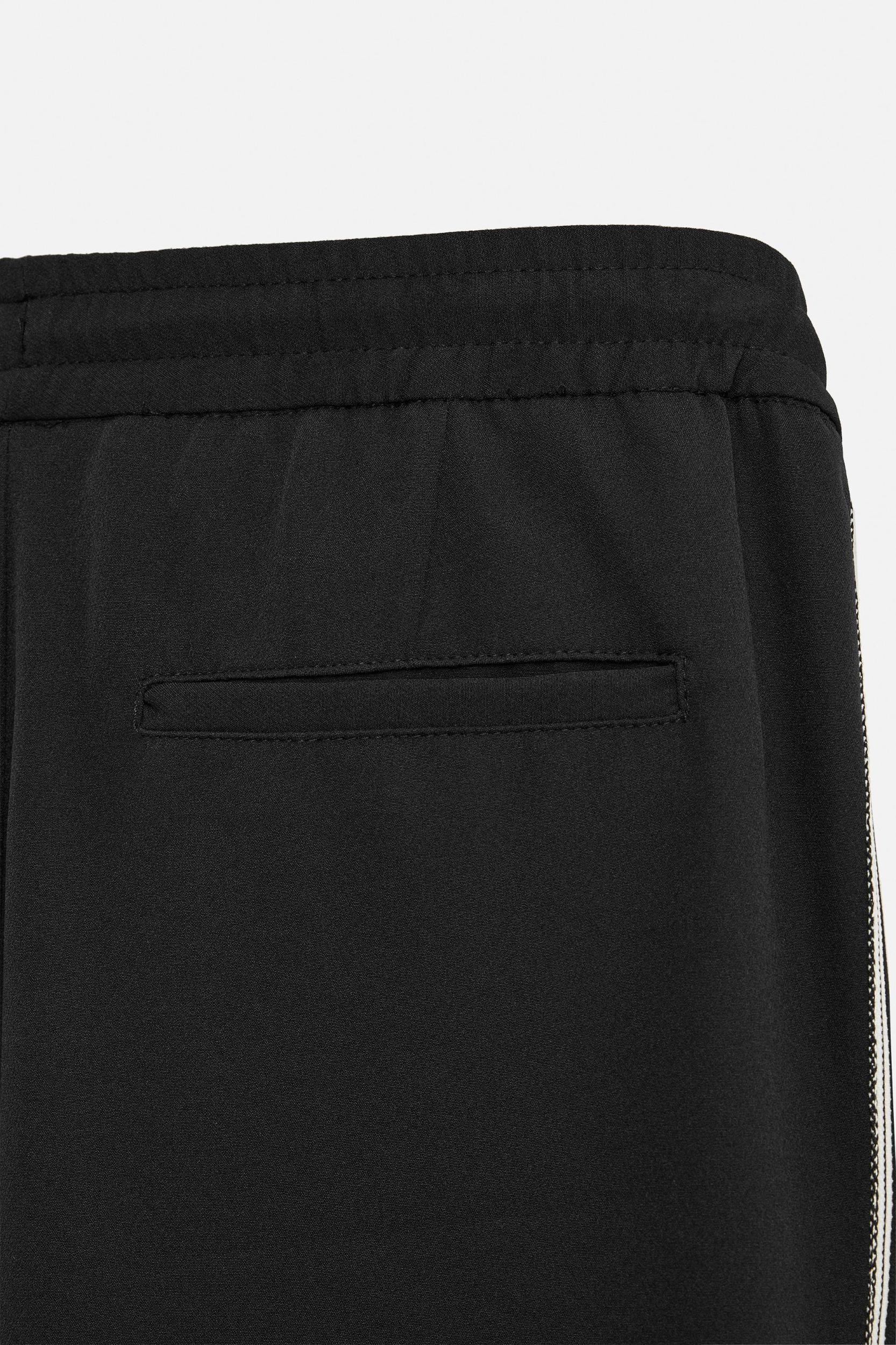 RELAXED FIT PANTS WITH CONTRASTING STRIPES Product Image