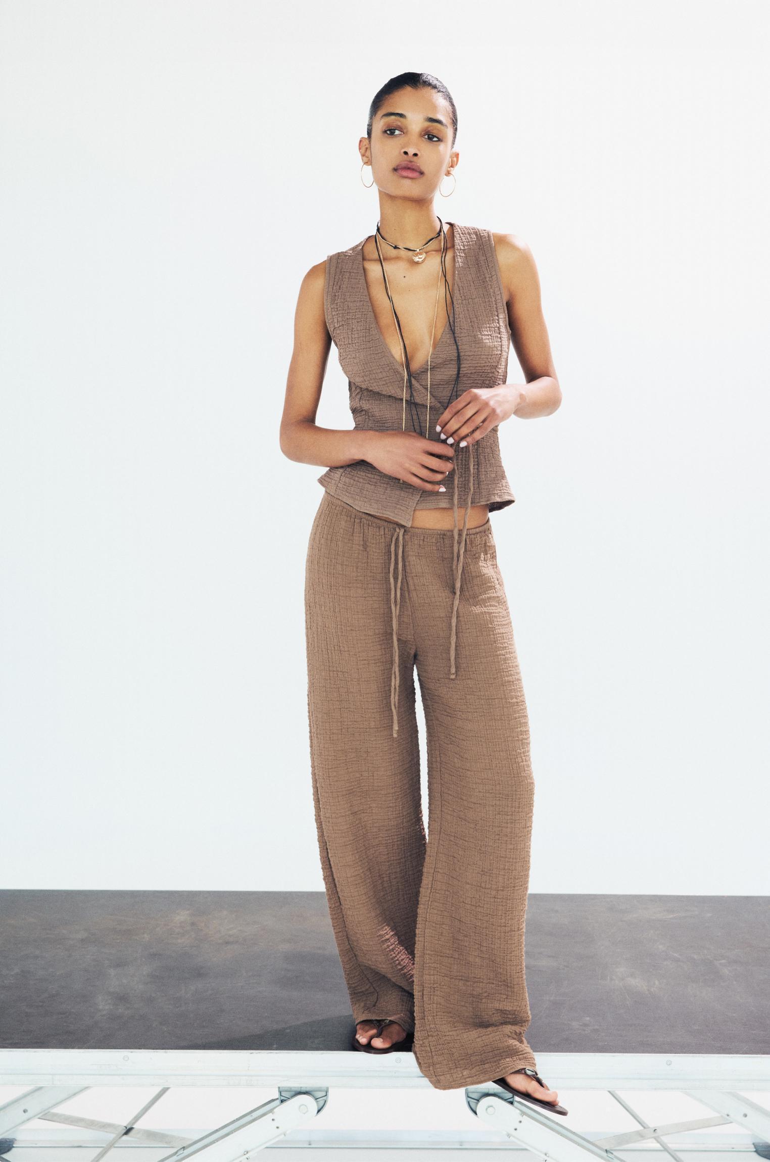 Rustic creased-effect pants Product Image