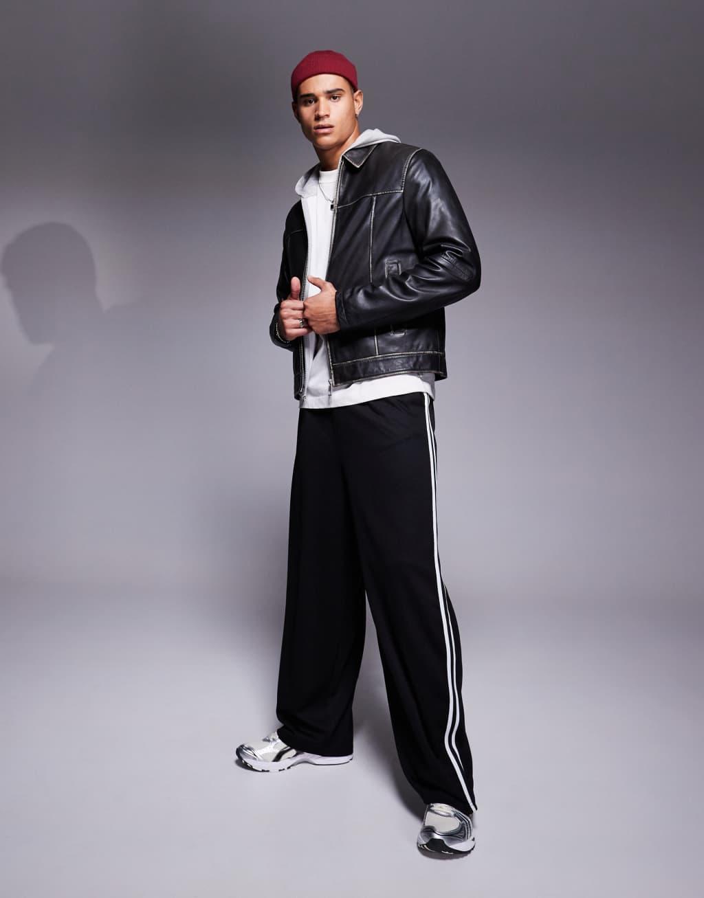 ASOS DESIGN baggy balloon sweatpants with side tape in black Product Image