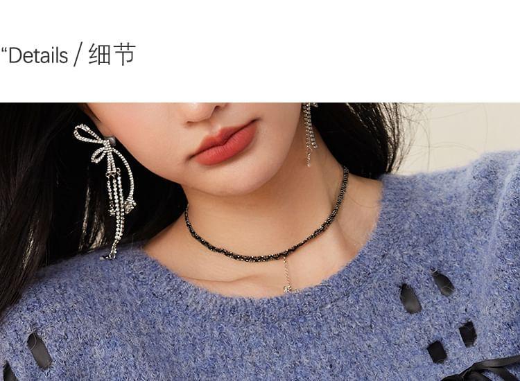 Round Neck Melange Bow Oversized Sweater Product Image