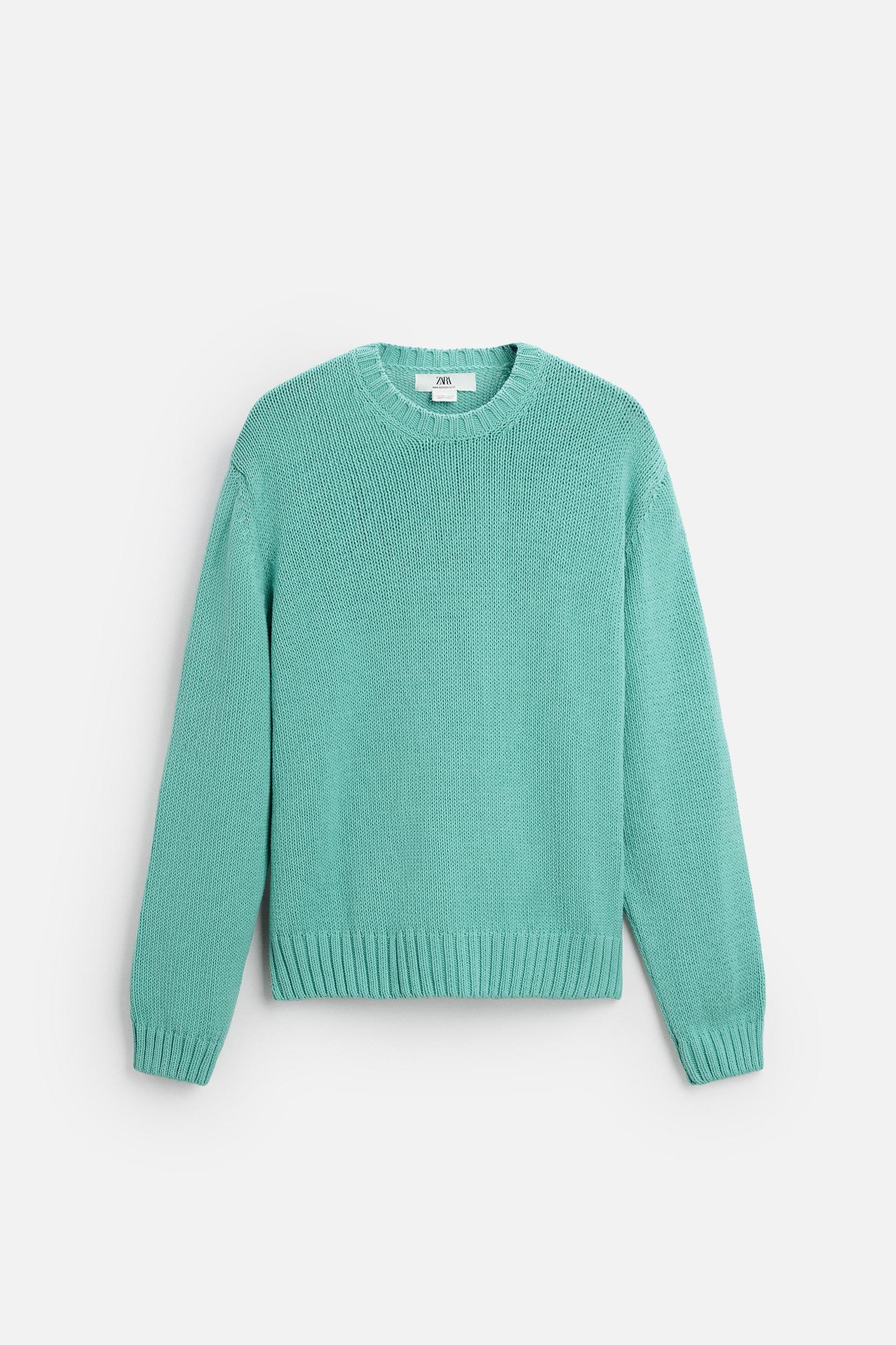 Relaxed fit cotton blend sweater. Round neck and long sleeves. Rib trim. Product Image