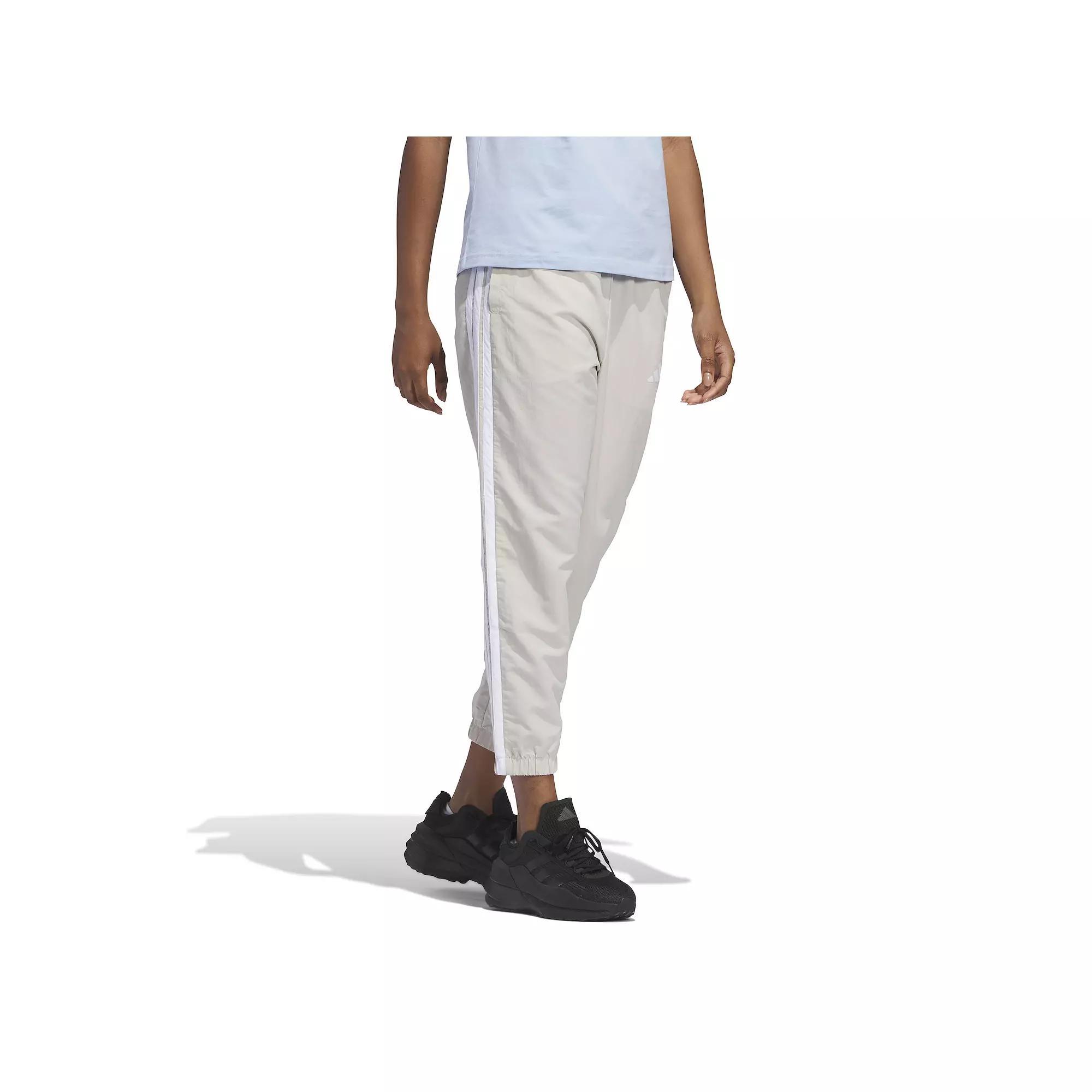 Women's adidas Essentials 3-Stripes Woven 7/8 Sportswear Pants, Size: Large, Wonder Alumina Product Image