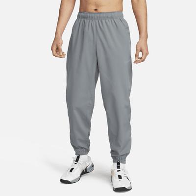 Nike Men's Form Dri-FIT Tapered Versatile Pants in Grey/Smoke Grey Size Large 100% Polyester Product Image