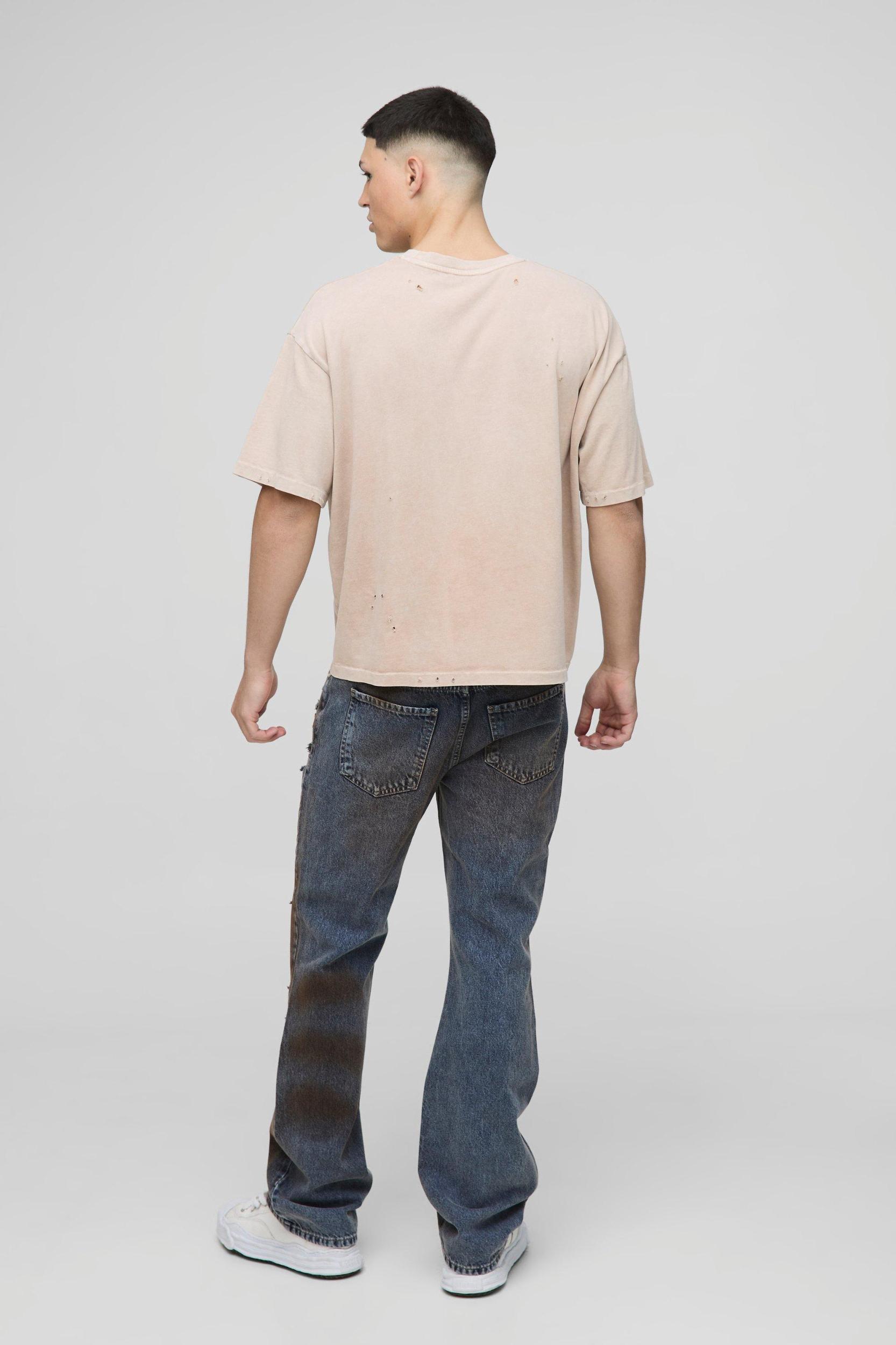 Slim Flared All Over Ripped Dirty Wash Jeans | boohooMAN USA Product Image