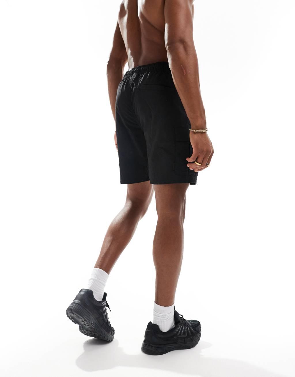Jack & Jones cargo swim shorts in black  Product Image