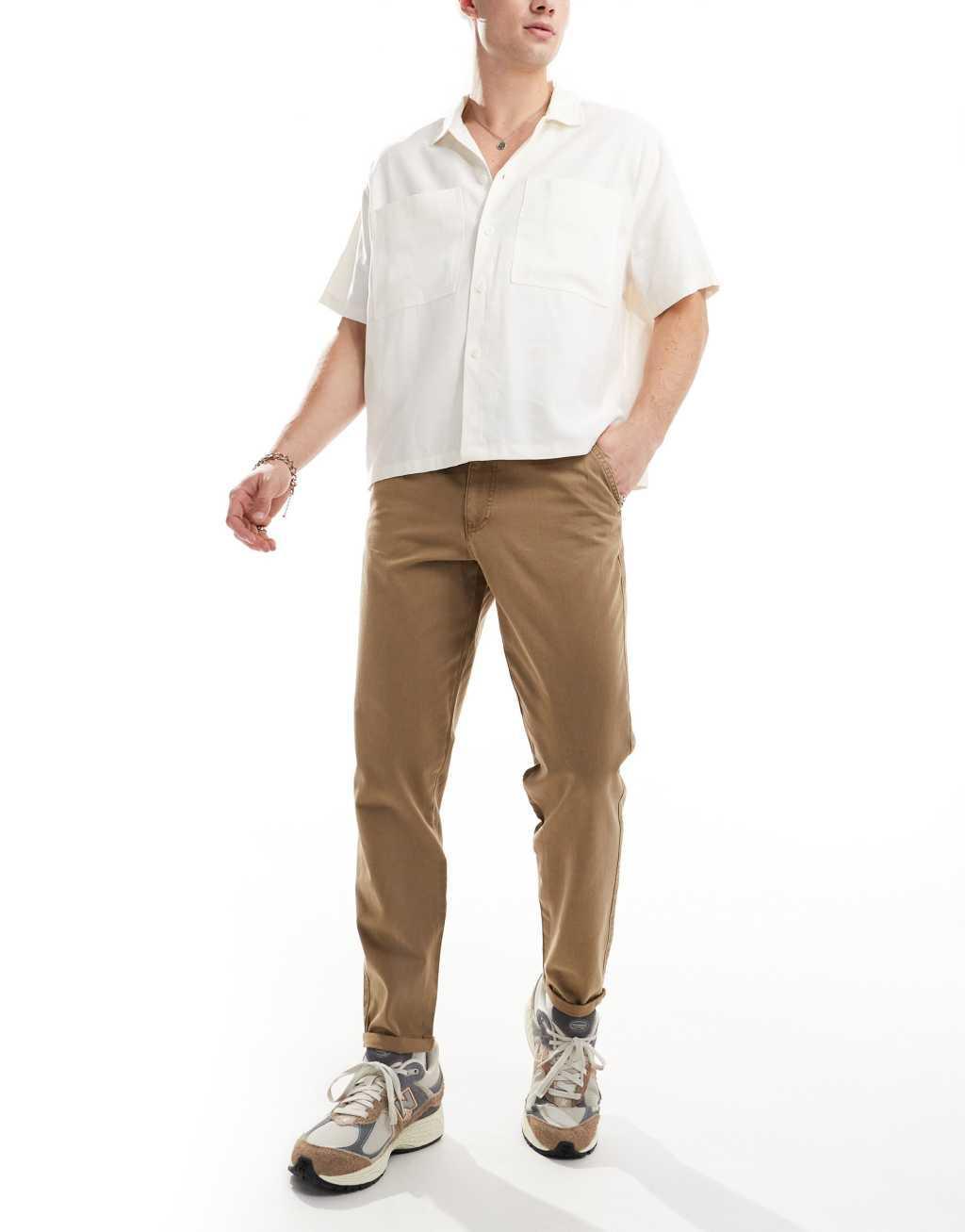 ASOS DESIGN classic rigid washed chino pants in brown Product Image