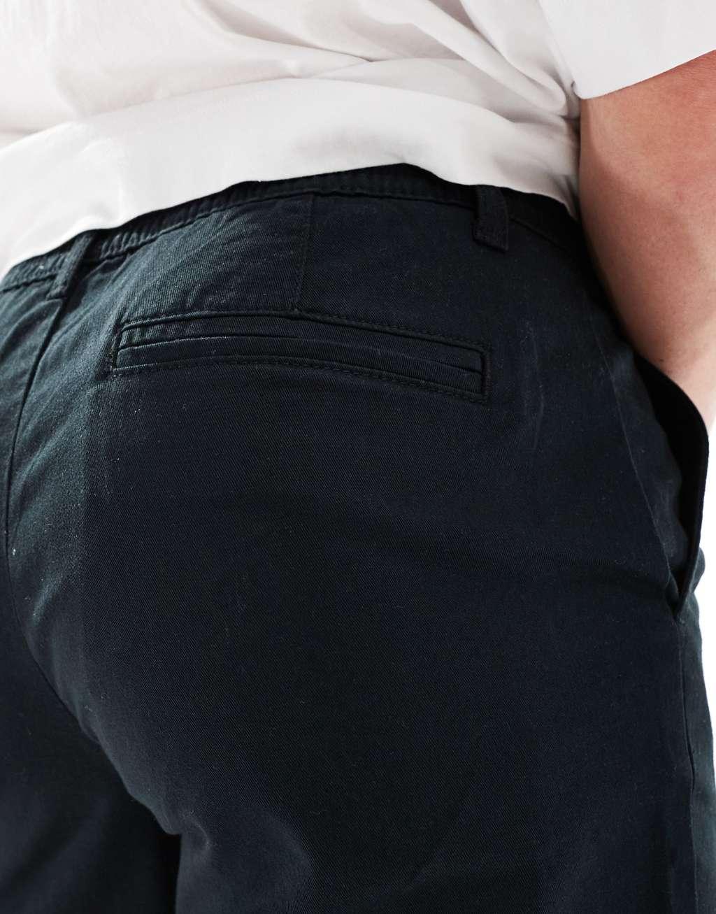 ASOS DESIGN pleated chino shorts in black Product Image