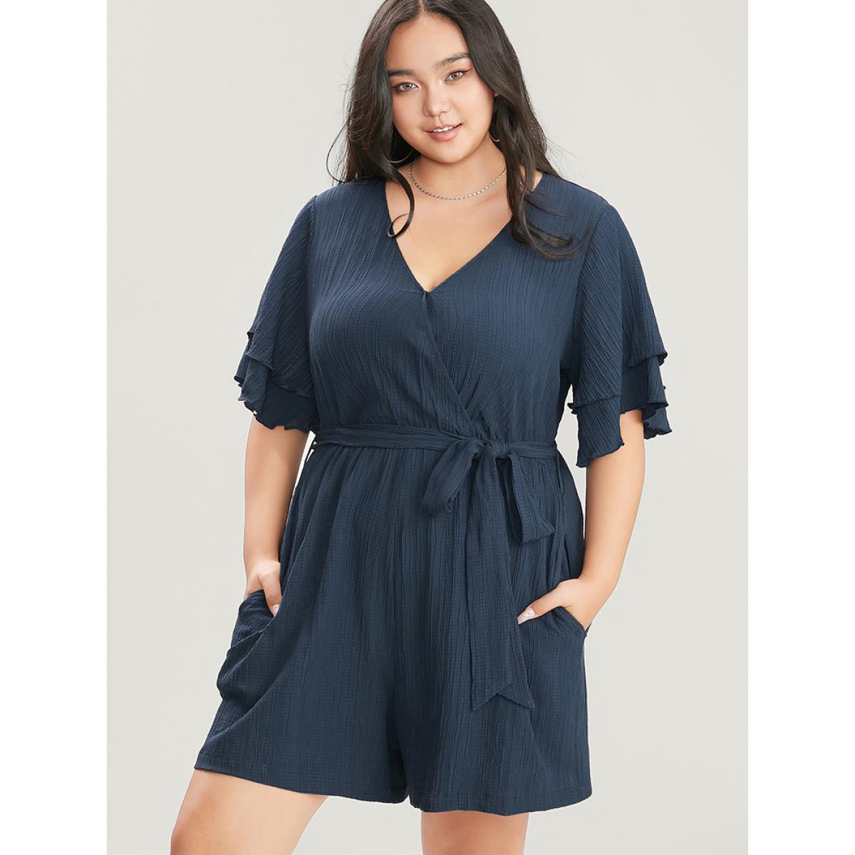 Plus Size Navy Plain Surplice Neck Ruffle Sleeve Pocket Belted Romper Women Elegant Short sleeve V-neck Dailywear Loose Jumpsuits BloomChic 12/L Product Image