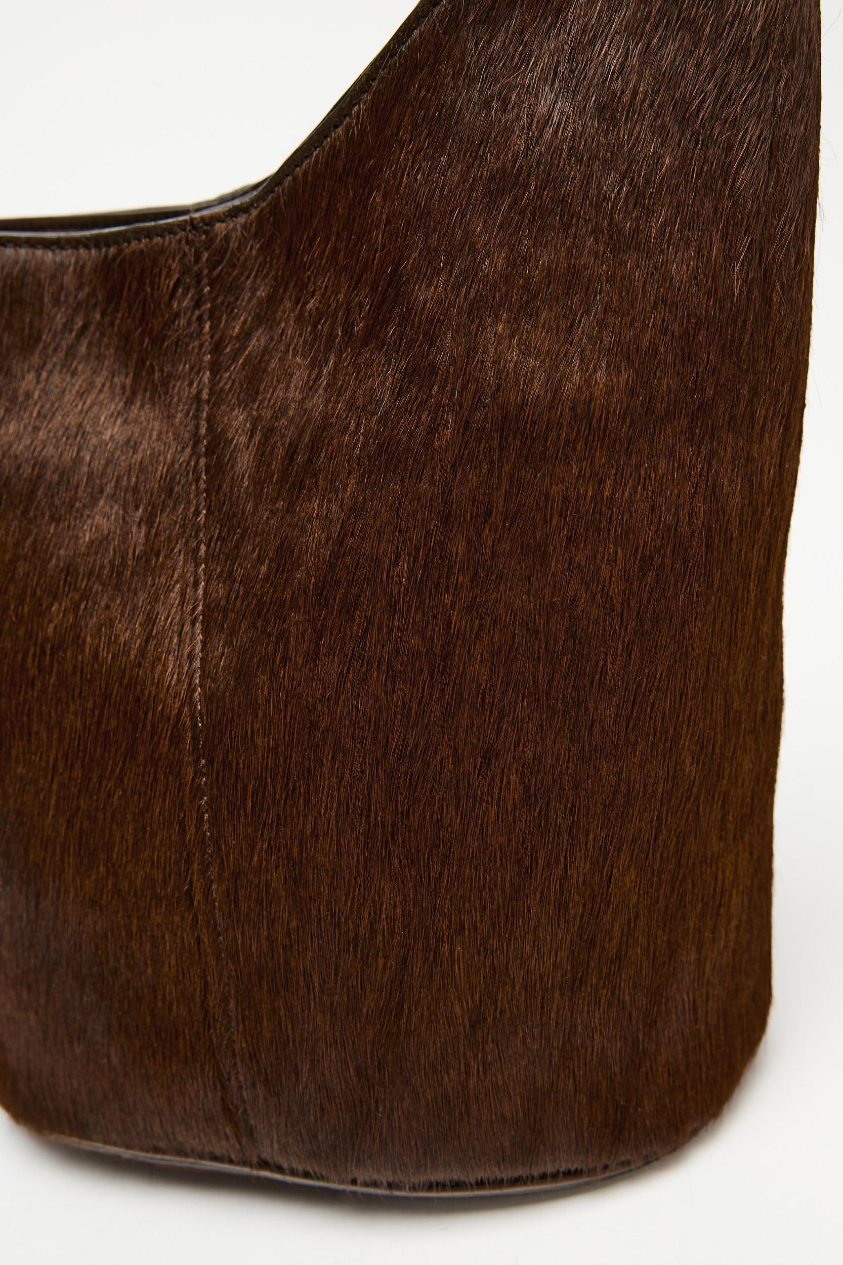 ASYMMETRIC FUR-TRIMMED LEATHER BUCKET BAG Product Image