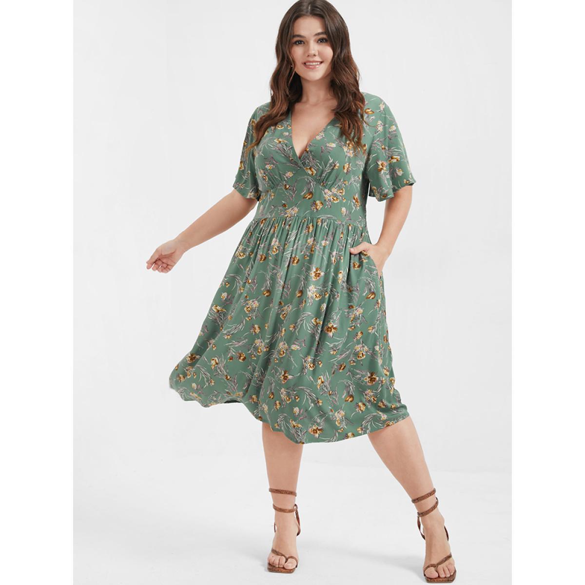 Plus Size Bloom Dress - Floral Flutter Shirred Pocket V Neck Dress Green Women Casual Gathered V-neck Short sleeve Curvy Midi Dress BloomChic 14-16/1X Product Image